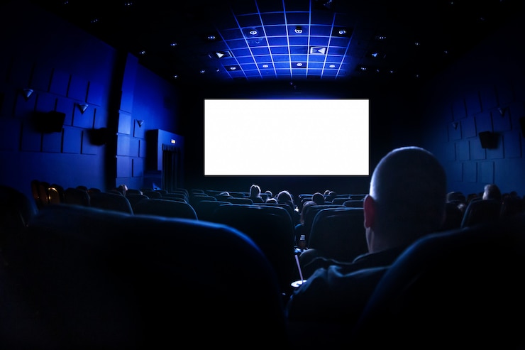 Photo cinema or theater in the auditorium. people watching a movie.