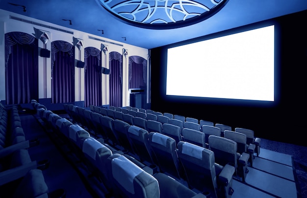 Cinema theater showing empty white movie screen