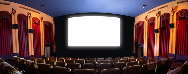 Photo cinema theater showing empty white movie screen.