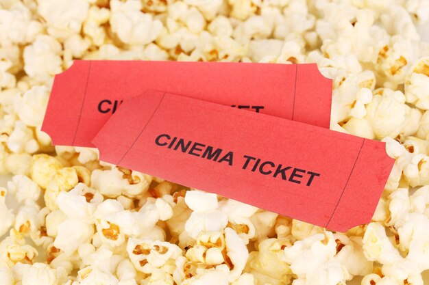 Photo cinema tickets on popcorn background