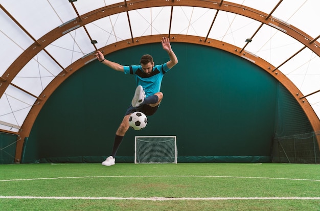 Cinematic image of a soccer freestyle player making tricks with the ball