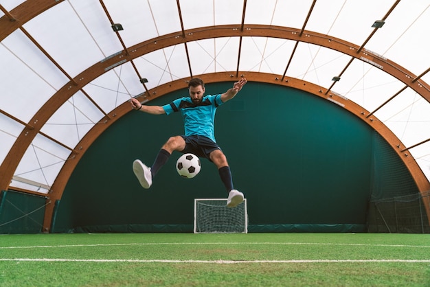 Cinematic image of a soccer freestyle player making tricks with the ball