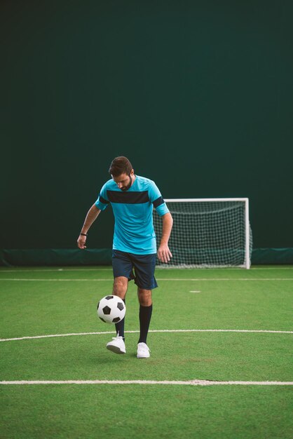 Cinematic image of a soccer freestyle player making tricks with the ball