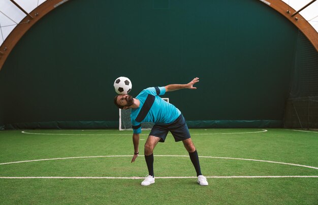 Cinematic image of a soccer freestyle player making tricks with the ball