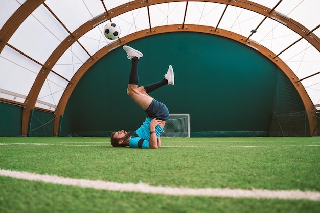 Photo cinematic image of a soccer freestyle player making tricks with the ball