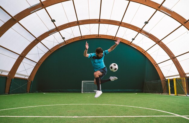 Cinematic image of a soccer freestyle player making tricks with the ball