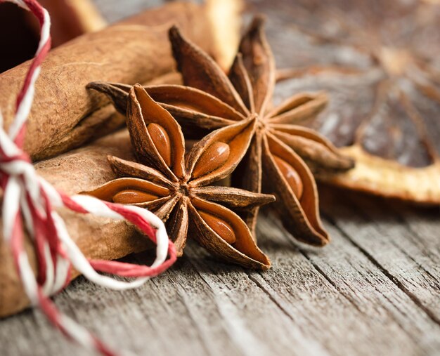 cinnamon anise and dried orange on a wooden table