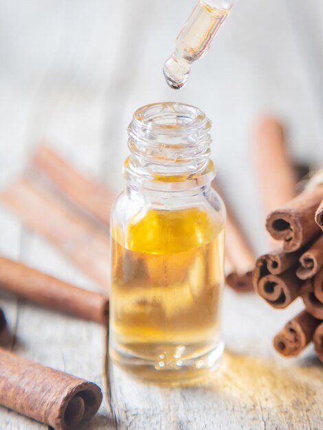 Cinnamon essential oil in a small bottle