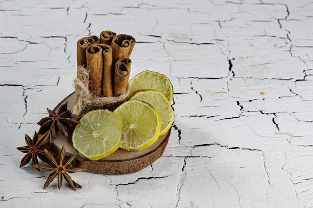 cinnamon lime and star anise on white cracked table