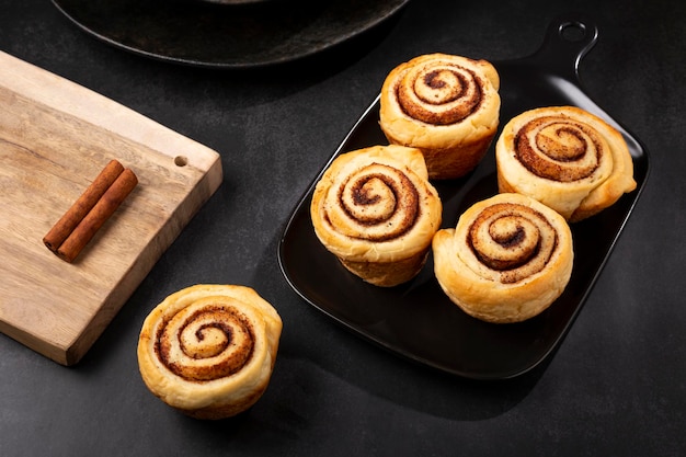 Cinnamon rolls on dark background