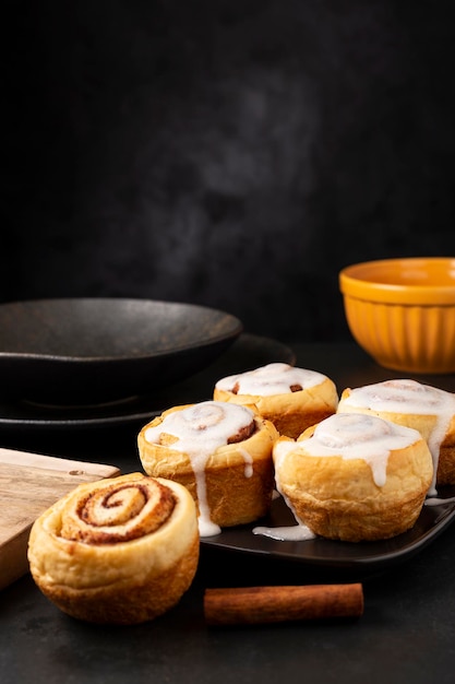 Cinnamon rolls on dark background