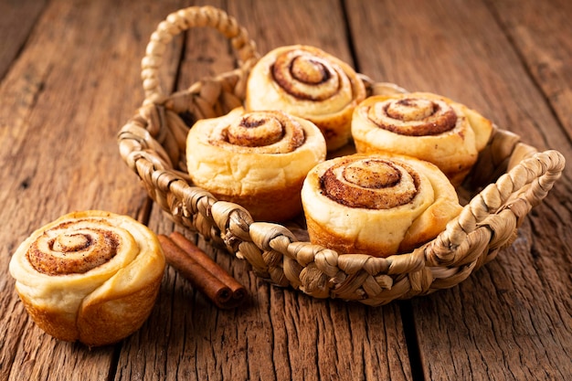 Cinnamon rolls on wooden background