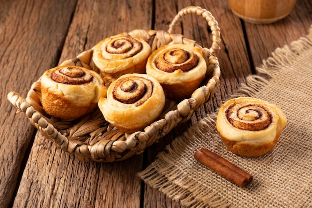 Cinnamon rolls on wooden background