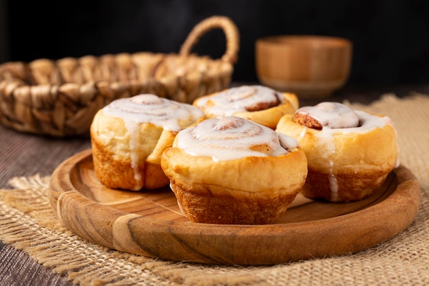 Cinnamon rolls on wooden background