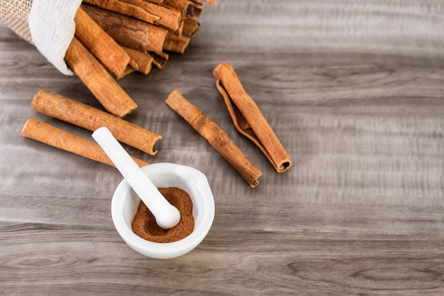 Cinnamon in a small mortar and pestle