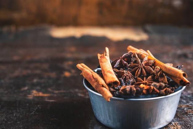 Cinnamon spices and anise stars in a bowl on the table