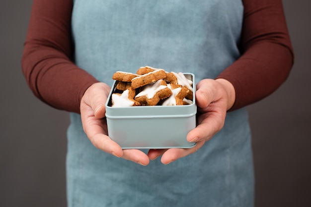 Cinnamon stars Zimtsterne traditional german christmas cookies in a box gingerbread with anise