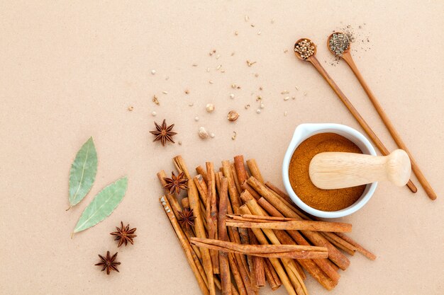 Cinnamon stick and cinnamon powder  on brown background .