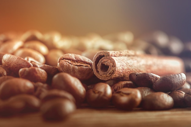 cinnamon stick and coffee beans on a wooden table