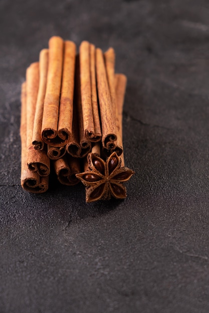 Cinnamon stick and star anise spice on black background