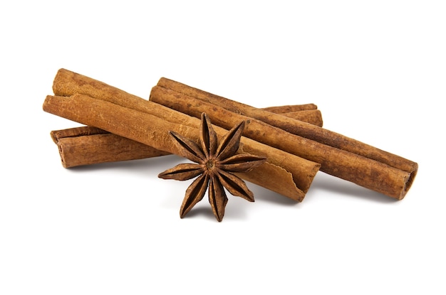 Cinnamon sticks and anise stars on white