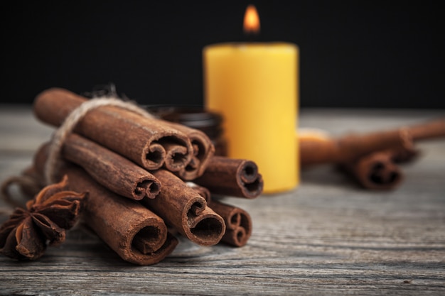 Cinnamon sticks and a candle