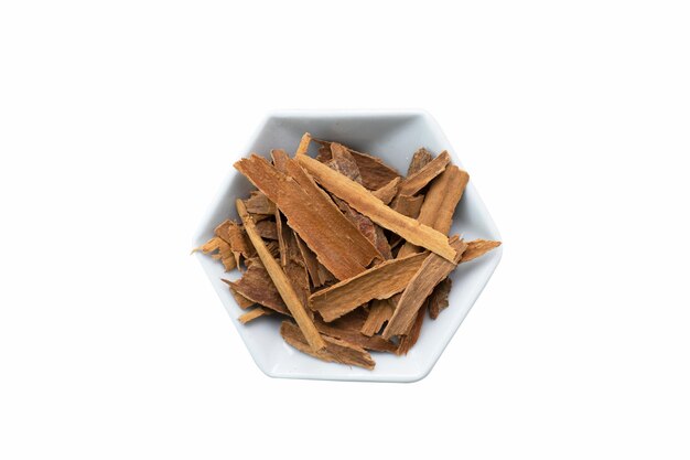 Cinnamon sticks on white hexagonal plate