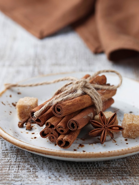 Cinnamon sticks in white plate