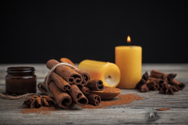 Cinnamon sticks on wooden table.