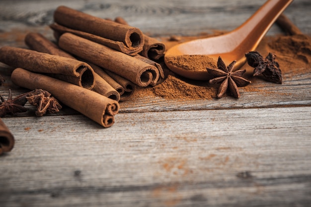 Cinnamon sticks on wooden table.