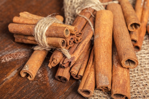 Cinnamon on wooden board.