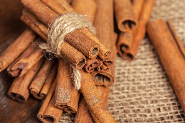 Cinnamon on wooden board.