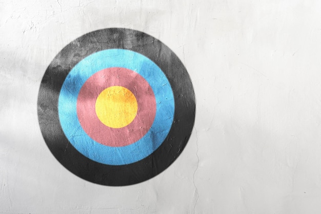 A circle dart target painted on the wall achievement concept