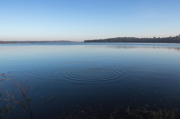 Circles on the blue lake with blue sky