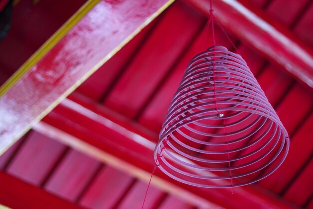 Circular incense is placed on the ceiling of a monastery