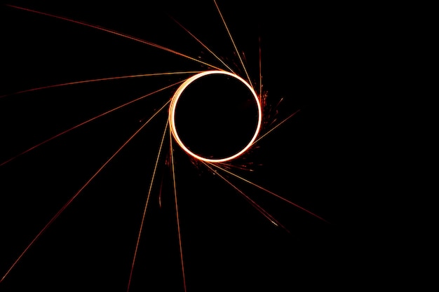 Circular lights with sparks on a black background