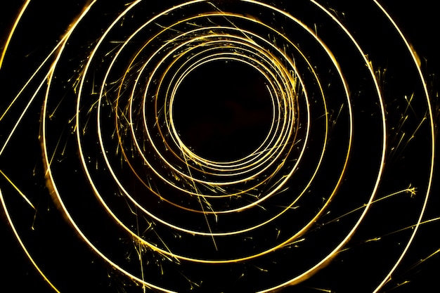 Circular lights with sparks on a black background