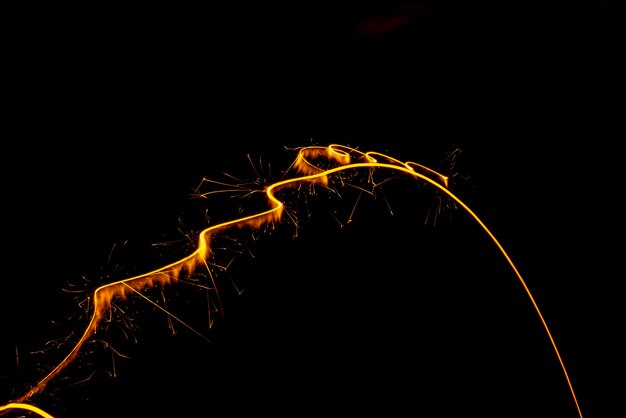 Circular lights with sparks on a black background