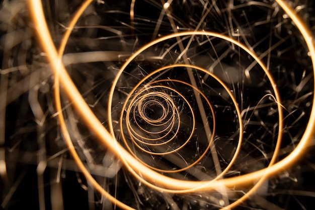 Photo circular lights with sparks on a black background