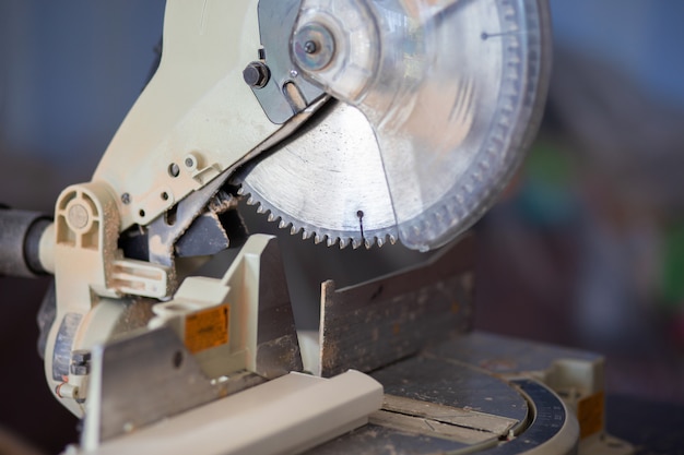 A circular saw on a workbench in an apartment. House repair, saw cut wooden products