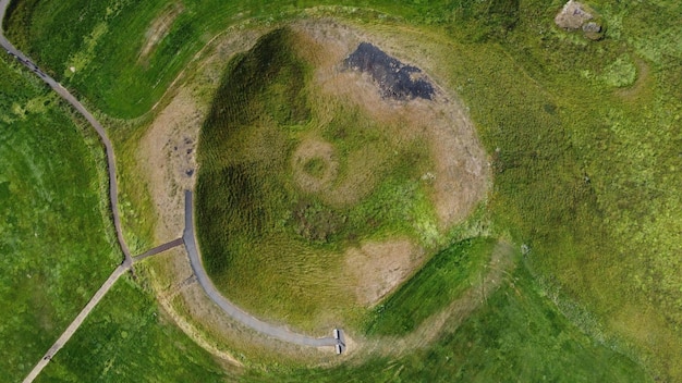 A circular structure with a path leading to the top