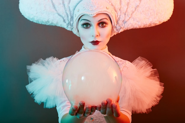 Circus performer magician shows tricks with soap bubbles