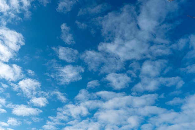 Cirrus clouds against a blue sky clear sunny day Beautiful background for the site