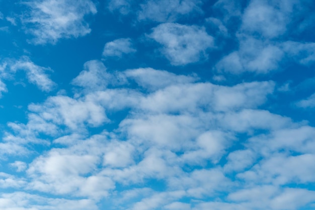 Cirrus clouds against a blue sky clear sunny day Beautiful background for the site