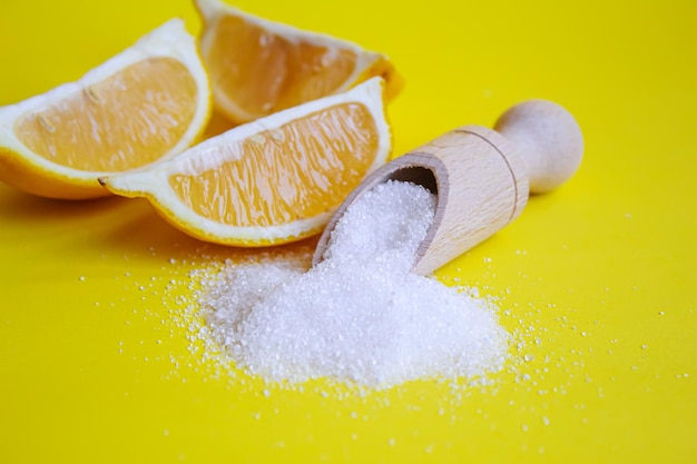 Citric acid on a yellow background Selective focus