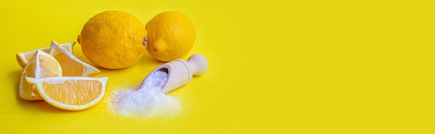 Citric acid on a yellow background Selective focus