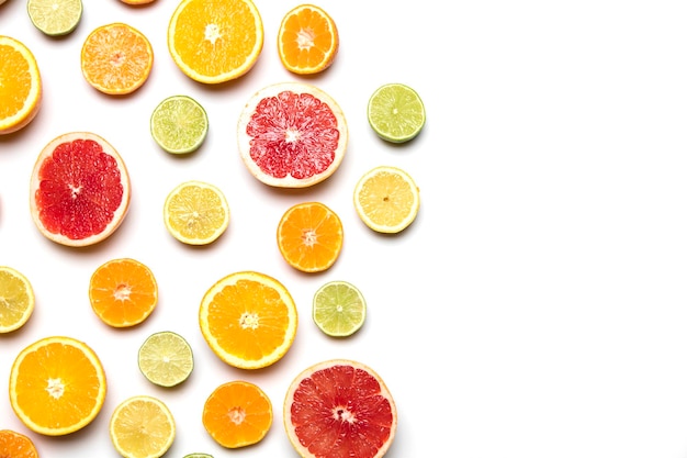 Citrus fruit background Slices of grapefruit orange lemon and lime