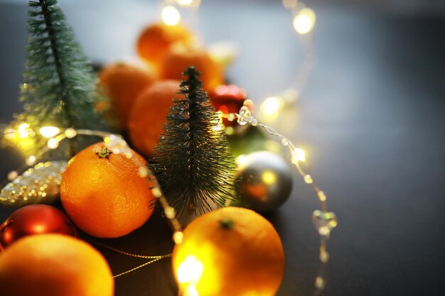 Citrus fruits on a gray background tangerines with leaves christmas fruit