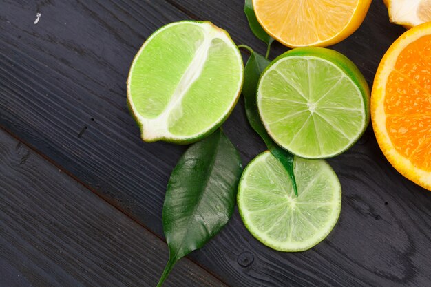 Citrus fruits slice on a black wooden table