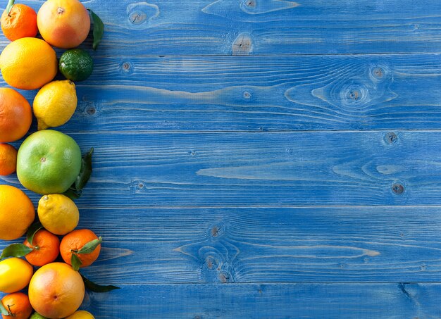 Citrus fruits on a wooden blue table